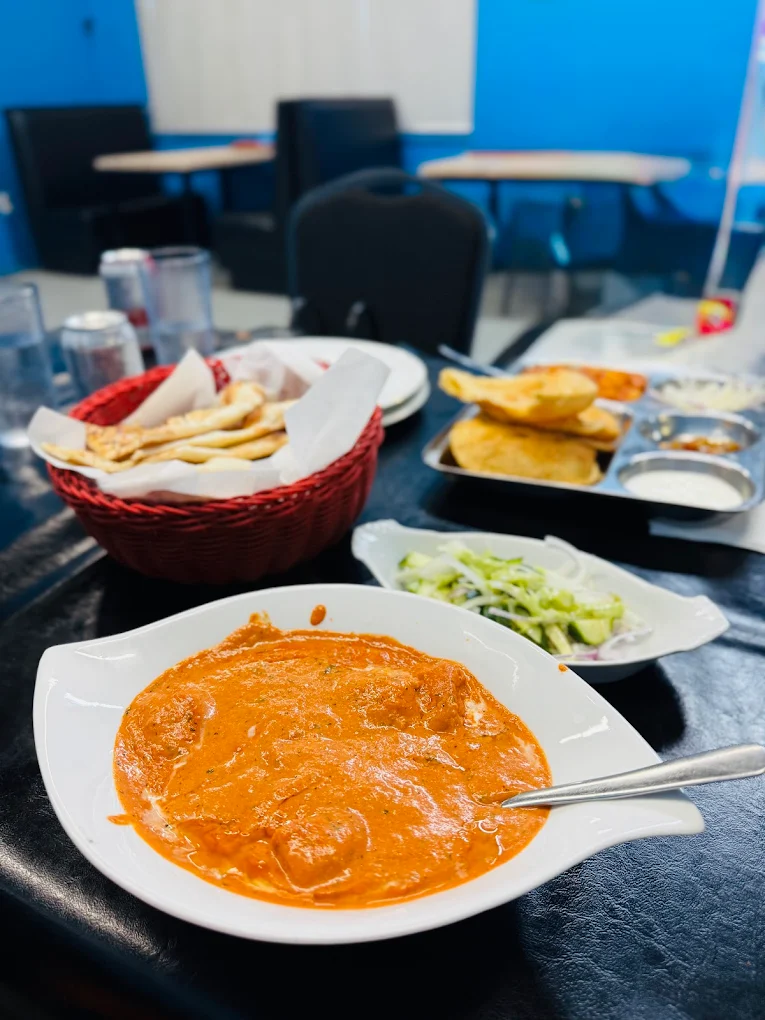 Order Indian food online Saskatoon - butter chicken with fresh naan from Dynamic Duo House of Naan & Curry